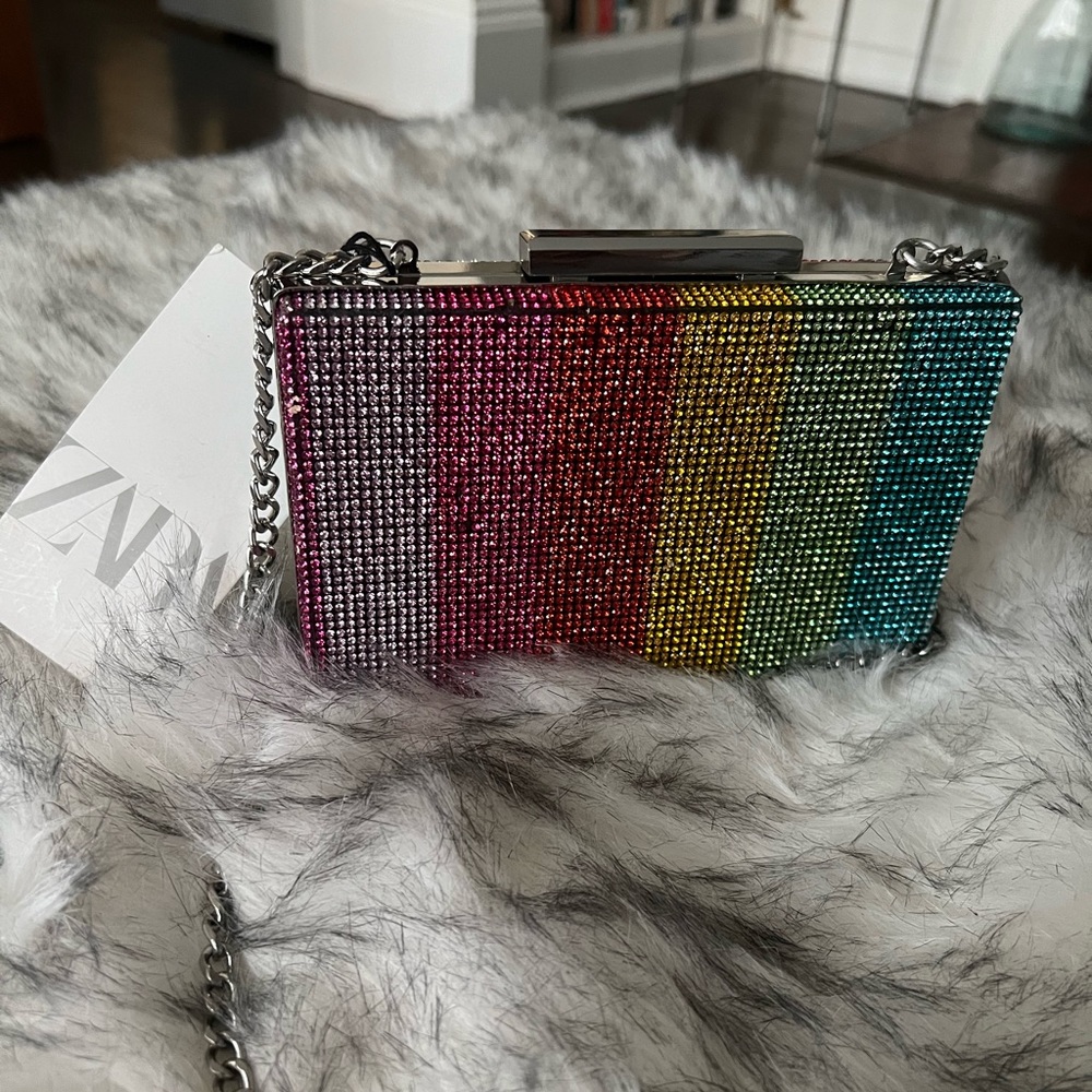 A sparkling rainbow clutch bag. Brand new wand never used with tag.